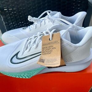Nike White Sneakers with Mint Green Outsole and Black Swoosh